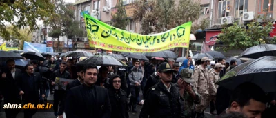 فریادهای بلند استکبار ستیز دانشگاه فرهنگیان استان کردستان همگام با مردم شهر زیر بارش شدید باران